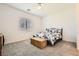Cozy bedroom with neutral carpet, a large window for natural light, and closet at 498 Pebble Run Ave, Henderson, NV 89011