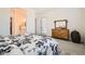 Bright bedroom with stylish dresser and natural light entering through the windows at 498 Pebble Run Ave, Henderson, NV 89011