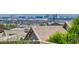 This backyard view captures the Las Vegas skyline beyond the rooftops of neighboring houses at 498 Pebble Run Ave, Henderson, NV 89011