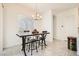 Cozy dining area featuring a modern table set, complemented by lots of natural light at 498 Pebble Run Ave, Henderson, NV 89011
