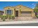 Charming single-story home featuring a two-car garage and a beautifully landscaped front yard at 498 Pebble Run Ave, Henderson, NV 89011