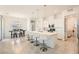 Modern kitchen featuring a large island with bar seating, white cabinetry, and stainless steel appliances at 498 Pebble Run Ave, Henderson, NV 89011