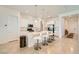 Bright kitchen with barstool seating at the island, stainless steel appliances, and ample counter space at 498 Pebble Run Ave, Henderson, NV 89011