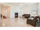 Comfortable living area with tile floors, lots of natural light, and modern furnishings at 498 Pebble Run Ave, Henderson, NV 89011