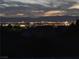 This night view captures the illuminated Las Vegas skyline from a beautiful neighborhood at 498 Pebble Run Ave, Henderson, NV 89011