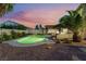 Large backyard with pool, spa, outdoor kitchen with built-in BBQ and comfortable patio seating at 5350 Sharon Marie Ct, Las Vegas, NV 89118