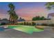 Beautiful backyard with pool, spa, desert landscaping, privacy wall, and mature palm trees at 5350 Sharon Marie Ct, Las Vegas, NV 89118