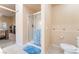 Bright bathroom features glass-enclosed shower and toilet at 5350 Sharon Marie Ct, Las Vegas, NV 89118