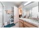 Bathroom with granite countertops, storage and glass-enclosed shower at 5350 Sharon Marie Ct, Las Vegas, NV 89118