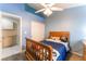 Cozy bedroom featuring carpet floors, closet, ceiling fan and stylish decor, ideal for comfortable living at 5350 Sharon Marie Ct, Las Vegas, NV 89118