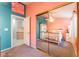 Bedroom with a closet that has mirrored doors, a ceiling fan, carpet floors, and adjacent to a storage area at 5350 Sharon Marie Ct, Las Vegas, NV 89118