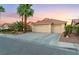 Inviting single-story home featuring a three-car garage, desert landscaping, and a serene ambiance at 5350 Sharon Marie Ct, Las Vegas, NV 89118