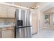 Kitchen featuring stainless steel refrigerator and granite countertops at 5350 Sharon Marie Ct, Las Vegas, NV 89118