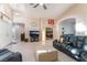 Bright and airy living room with tile floors, vaulted ceiling, and comfortable leather seating arrangement at 5350 Sharon Marie Ct, Las Vegas, NV 89118