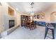 Spacious living room featuring fireplace, dining table, and cozy seating area at 5350 Sharon Marie Ct, Las Vegas, NV 89118