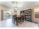 Bright living room with tile floors, dining table, fireplace, and sliding glass doors at 5350 Sharon Marie Ct, Las Vegas, NV 89118