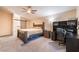 Spacious main bedroom with en-suite bathroom, large bed, and office area at 5350 Sharon Marie Ct, Las Vegas, NV 89118
