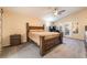 Main bedroom with large bed, ceiling fan, and access to the backyard at 5350 Sharon Marie Ct, Las Vegas, NV 89118