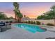 Inviting backyard features a refreshing pool and spa combo with desert landscaping for outdoor enjoyment at 5350 Sharon Marie Ct, Las Vegas, NV 89118