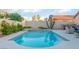 Refreshing pool and spa combo surrounded by desert landscaping, offering a private oasis for outdoor enjoyment at 5350 Sharon Marie Ct, Las Vegas, NV 89118
