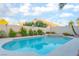 Private pool and spa surrounded by desert landscaping, providing a tranquil outdoor retreat at 5350 Sharon Marie Ct, Las Vegas, NV 89118