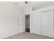 Bedroom featuring closet and view to hall, newly painted and carpeted at 538 Ancient Mayan Dr, Henderson, NV 89015