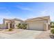 Inviting home with desert landscaping, a wide driveway, and a two-car garage, showcasing curb appeal at 538 Ancient Mayan Dr, Henderson, NV 89015