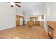 Spacious living room with vaulted ceiling, fireplace, tile floors, eat-in kitchen with island and white appliances at 538 Ancient Mayan Dr, Henderson, NV 89015