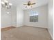 Comfortable living room with neutral carpeting, abundant natural light, and modern ceiling fixtures for a cozy atmosphere at 538 Ancient Mayan Dr, Henderson, NV 89015