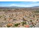 Aerial view of a bustling residential neighborhood with neatly arranged homes and scenic mountain backdrop at 538 Ancient Mayan Dr, Henderson, NV 89015