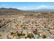 Aerial view of a desert neighborhood, showcasing houses and the distant mountain landscape at 538 Ancient Mayan Dr, Henderson, NV 89015