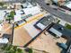 The aerial view shows the home, detached garage, and large lot with fencing, offering privacy and potential at 5580 Waltham Ln, Las Vegas, NV 89122