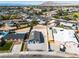 Aerial view of a residential lot with a home and spacious surroundings in a neighborhood with mountain views at 5580 Waltham Ln, Las Vegas, NV 89122