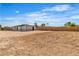 Large vacant lot surrounded by a wooden fence providing ample space for customization and construction opportunities at 5580 Waltham Ln, Las Vegas, NV 89122