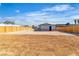 Spacious backyard enclosed by a wooden fence, offering privacy and potential for landscaping or development at 5580 Waltham Ln, Las Vegas, NV 89122