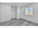 Bright bedroom with ample natural light, closet, and modern flooring at 5580 Waltham Ln, Las Vegas, NV 89122