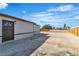 Side yard with a concrete driveway and a new wooden fence for added privacy at 5580 Waltham Ln, Las Vegas, NV 89122