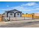 Charming home featuring a secure fence, desert landscaping, and unique window accents at 5580 Waltham Ln, Las Vegas, NV 89122