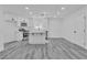 Spacious kitchen with modern white cabinets, stainless steel appliances, and an island at 5580 Waltham Ln, Las Vegas, NV 89122