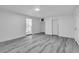 Room featuring light wood floors, neutral walls and a doorway with a kitchen in view at 5580 Waltham Ln, Las Vegas, NV 89122