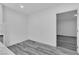 Bright and airy room with neutral walls, light wood floors, and large doorway at 5580 Waltham Ln, Las Vegas, NV 89122
