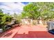 Backyard featuring mature landscaping, ample patio space, and a privacy wall at 602 Painted Cloud Pl, Las Vegas, NV 89144