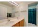 Bathroom featuring a double sink vanity with ample counter space and a large mirror at 602 Painted Cloud Pl, Las Vegas, NV 89144