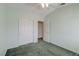 Bedroom with carpeted floor, fan, and sliding closet doors at 602 Painted Cloud Pl, Las Vegas, NV 89144