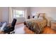 Comfortable bedroom with natural light, a workstation, and a serene ambiance at 602 Painted Cloud Pl, Las Vegas, NV 89144