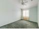 Bedroom featuring a ceiling fan, carpeted floor, and natural light from the window at 602 Painted Cloud Pl, Las Vegas, NV 89144