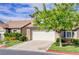 Charming two-story home featuring a two-car garage, well-maintained lawn and stone veneer accents at 602 Painted Cloud Pl, Las Vegas, NV 89144