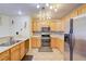 Spacious kitchen featuring modern appliances, ample cabinetry, and a stylish backsplash at 602 Painted Cloud Pl, Las Vegas, NV 89144