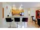Cozy kitchen with breakfast bar, wooden cabinets and stainless steel appliances at 602 Painted Cloud Pl, Las Vegas, NV 89144