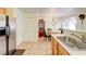 Bright kitchen featuring stainless steel appliances, ample storage, and seamless access to the dining area at 602 Painted Cloud Pl, Las Vegas, NV 89144